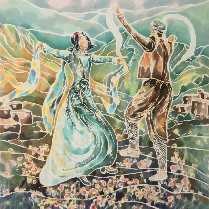 A square silk painting of two dancers in a mountain landscape. A woman in a flowing teal dress and small red cap spreads her arms as sheer patterned scarves swirl around her. A man in a brown vest and wide trousers, with diamond-patterned leg wraps, raises a white scarf above his head. Behind them rise layered green and ochre hills with stone houses; in front, a meadow of pink and yellow flowers. Fine white resist lines outline every shape.