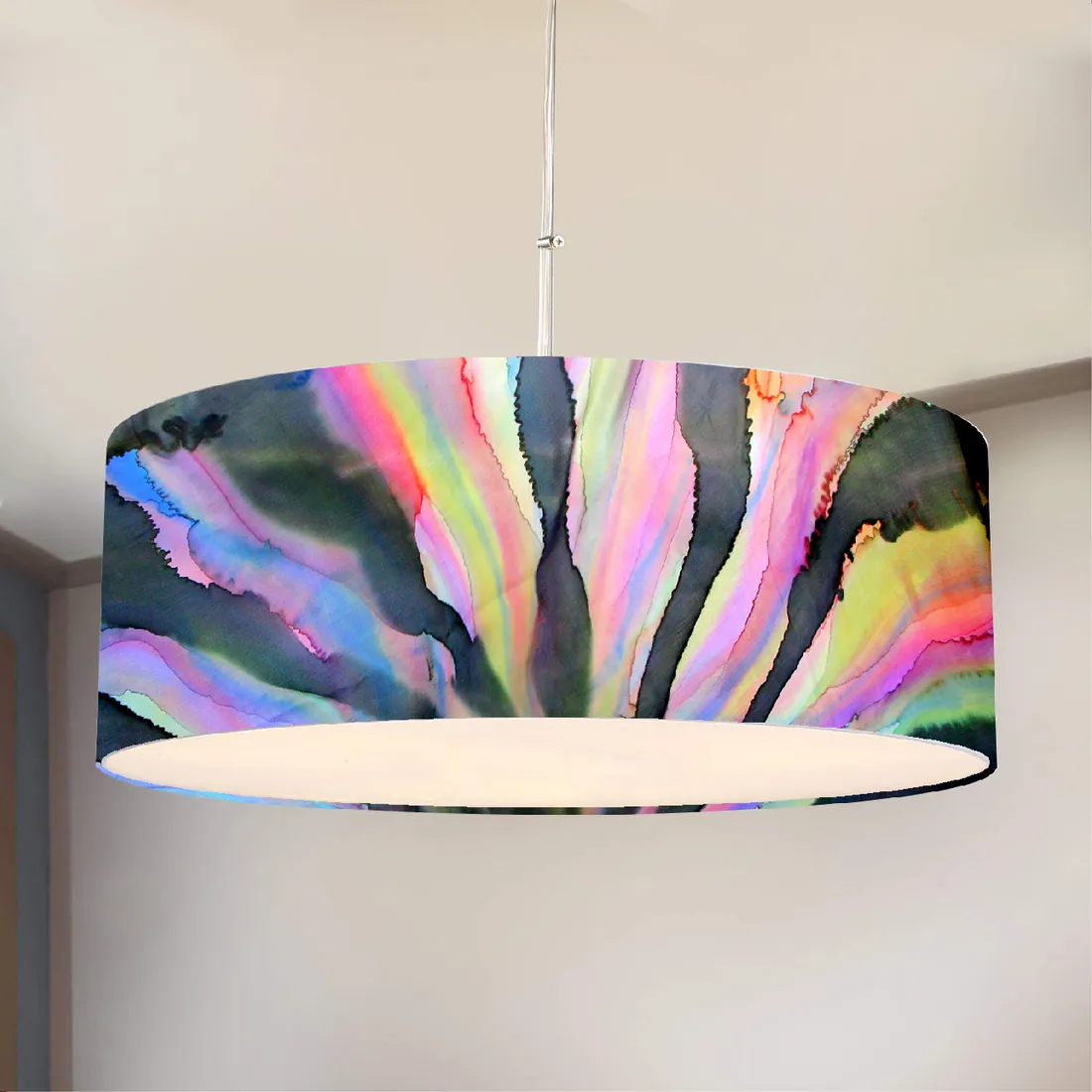 A large drum-shaped pendant lampshade painted with radiating streaks of black, pink, violet, yellow and green.