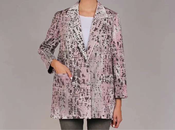 Front view of a tailored jacket painted in rose, gray and white with dotted, block-like patterns, worn open over a white top.