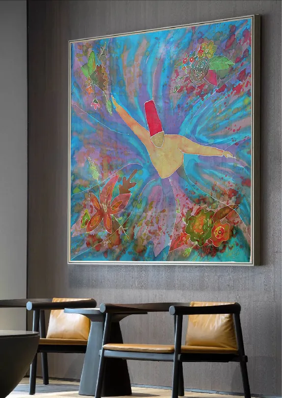 A large framed painting of a single whirling dervish with outstretched arms in a swirl of turquoise, surrounded by red and orange flowers, hanging above two leather chairs.